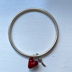 Silver bangle with charms
